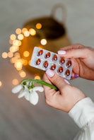 person holding silver blister pack