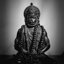 gold buddha figurine on black table