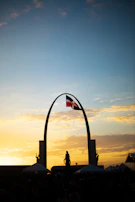 Veterans and community members gathered during a remembrance ceremony at sunset.