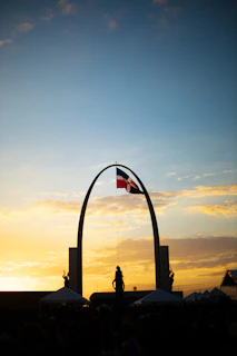 Veterans and community members gathered during a remembrance ceremony at sunset.