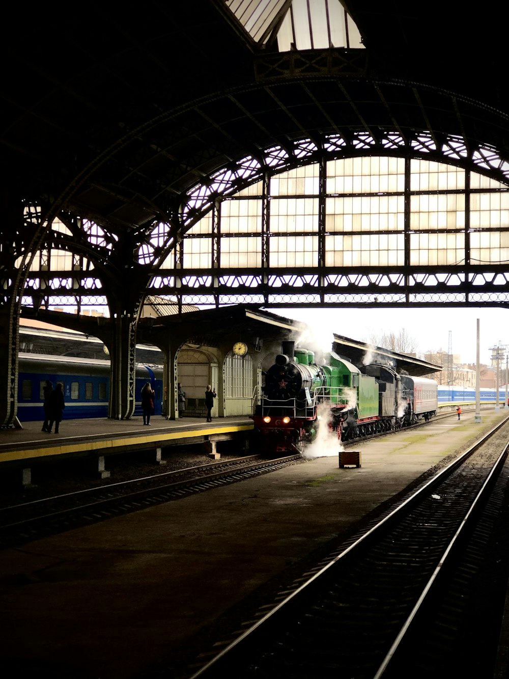 people standing on train station during daytime