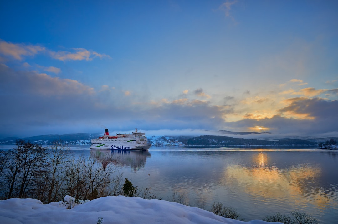 white ship on sea under blue sky during daytime