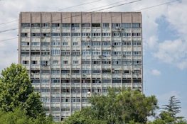 Modern apartment building with open windows letting in fresh city air in New York.