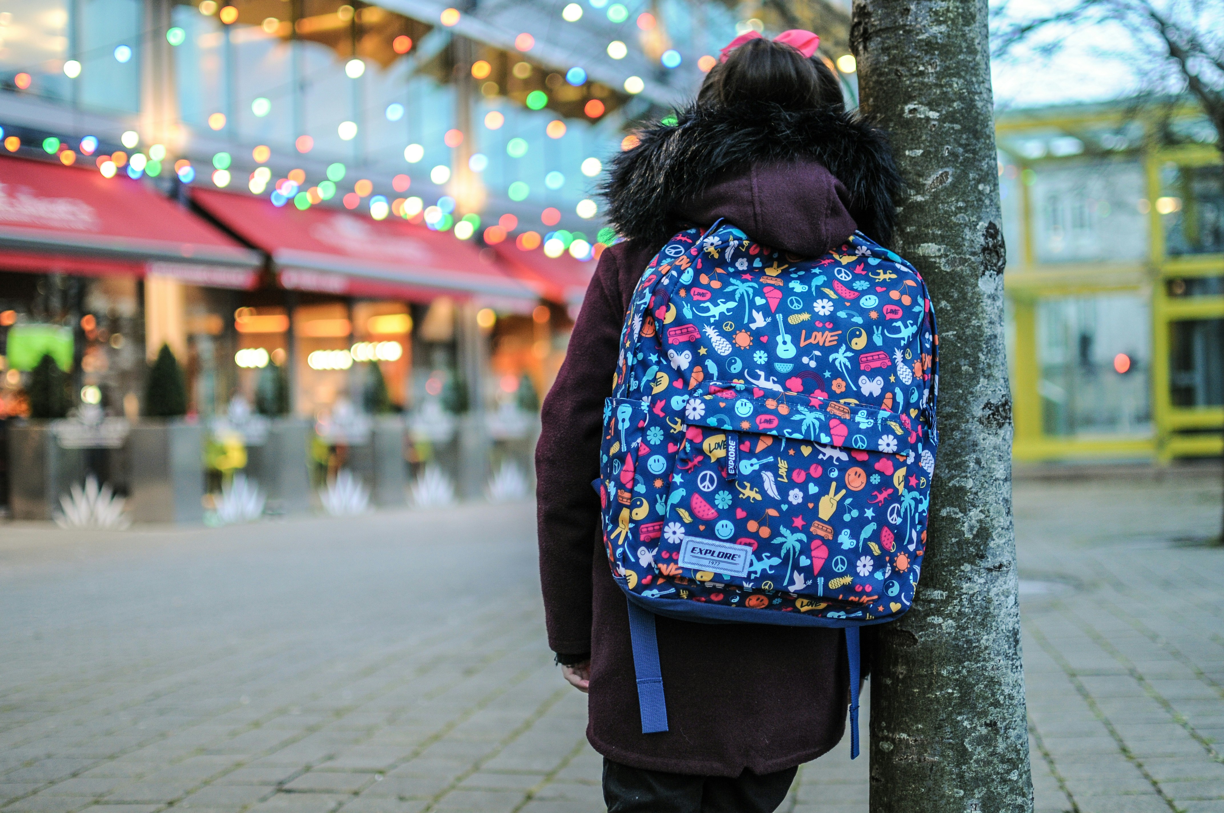 Young girl with colorful backpack