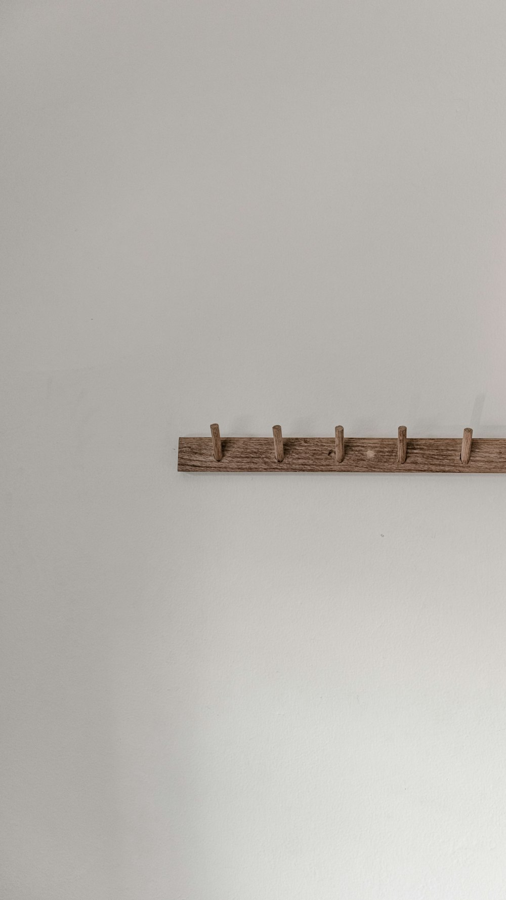 brown wooden wall mounted rack