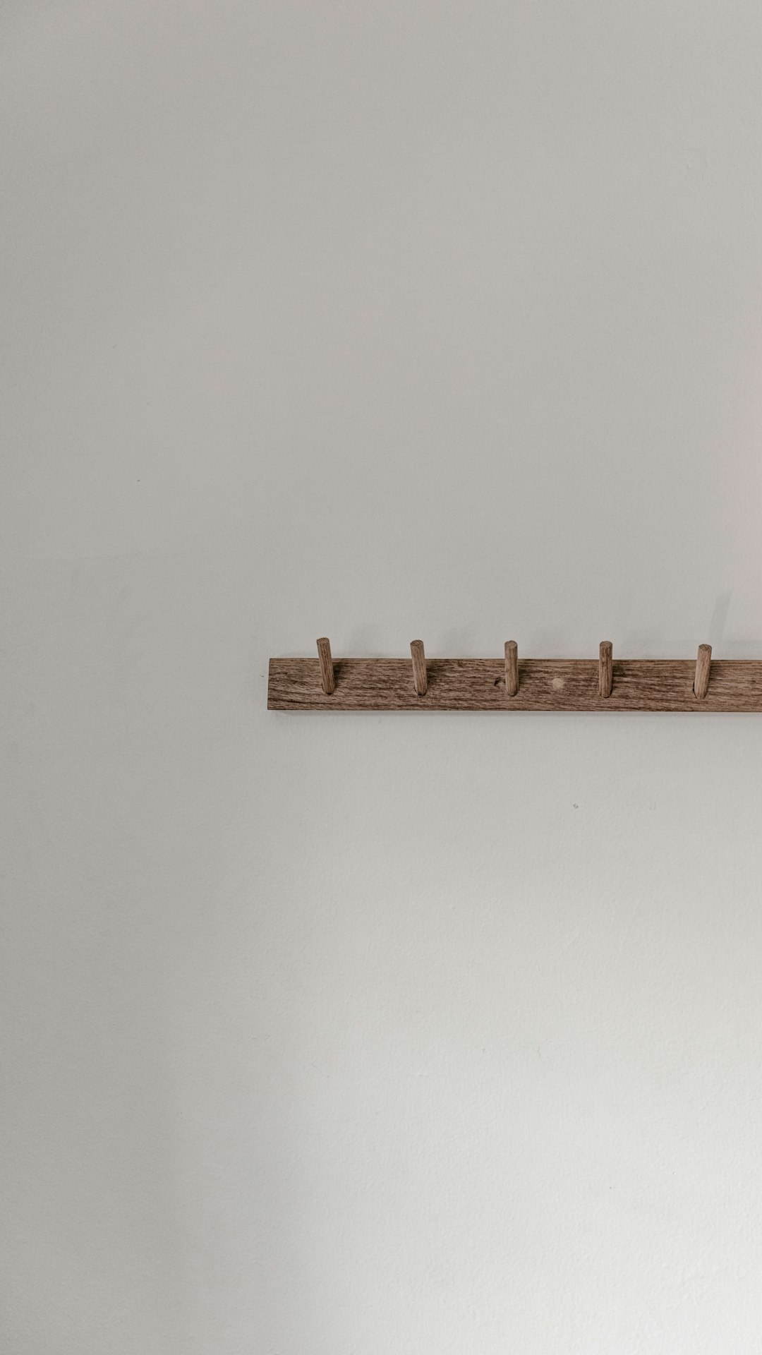 brown wooden wall mounted rack