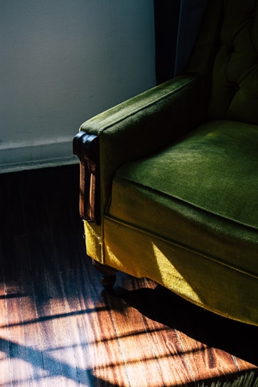 A cozy vintage armchair with a modern twist, bathed in warm natural light.