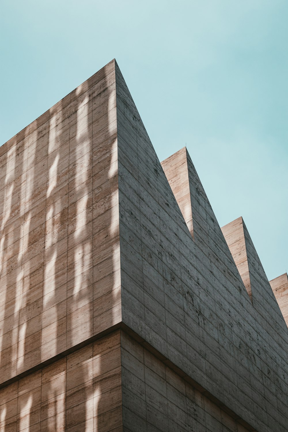 brown concrete building under blue sky during daytime