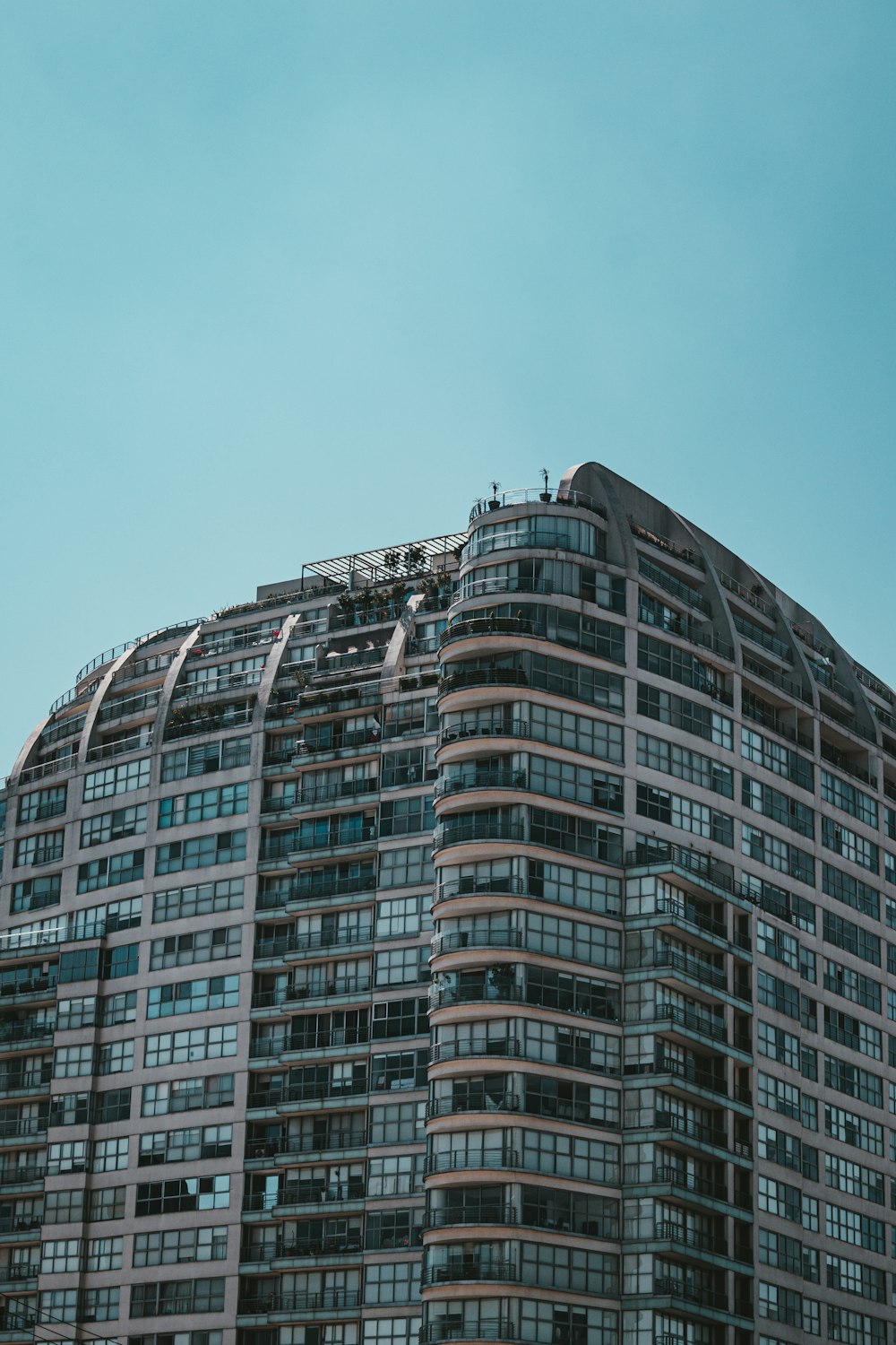 white and black concrete building under blue sky during daytime