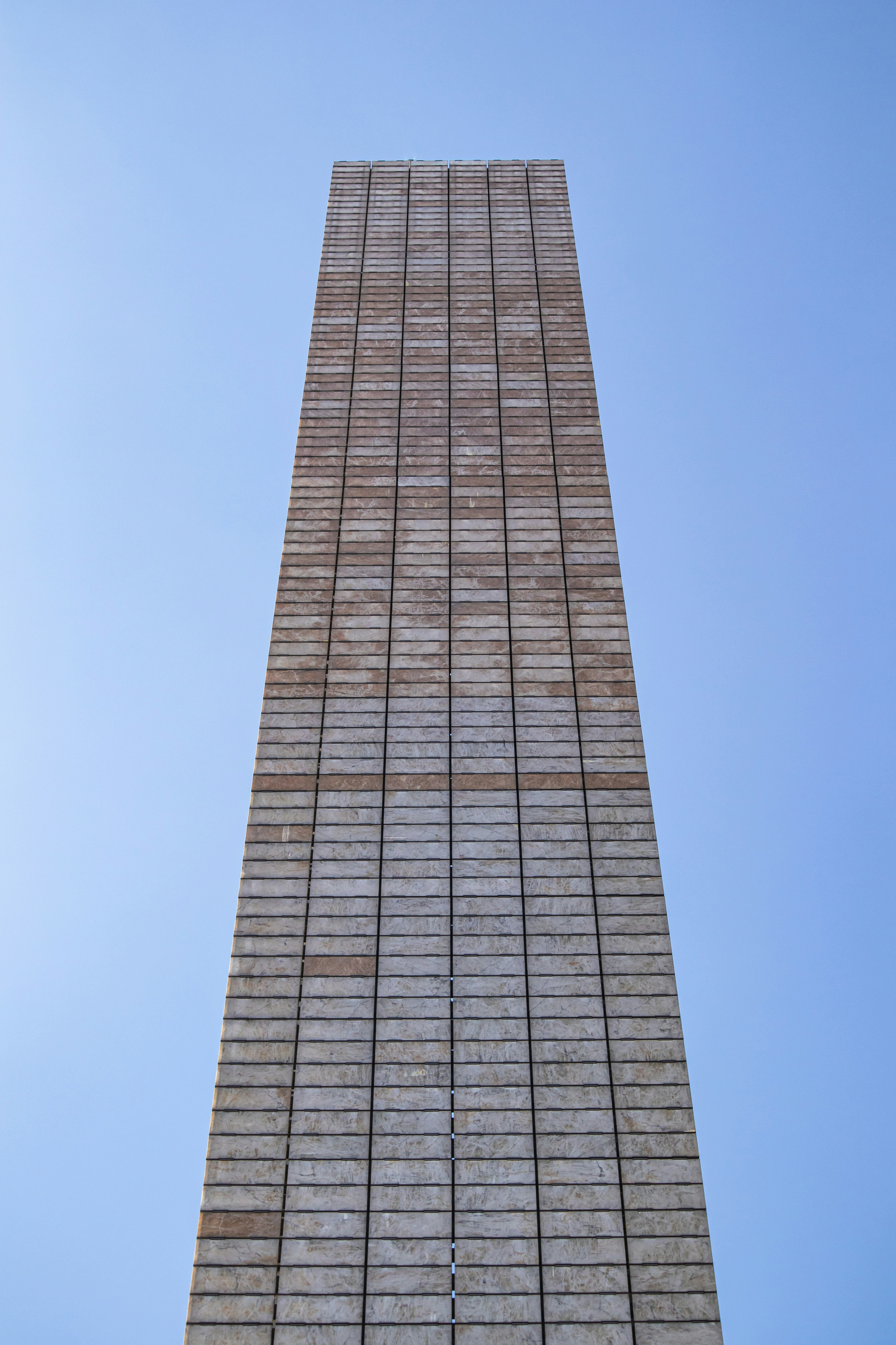 brown concrete building under blue sky during daytime