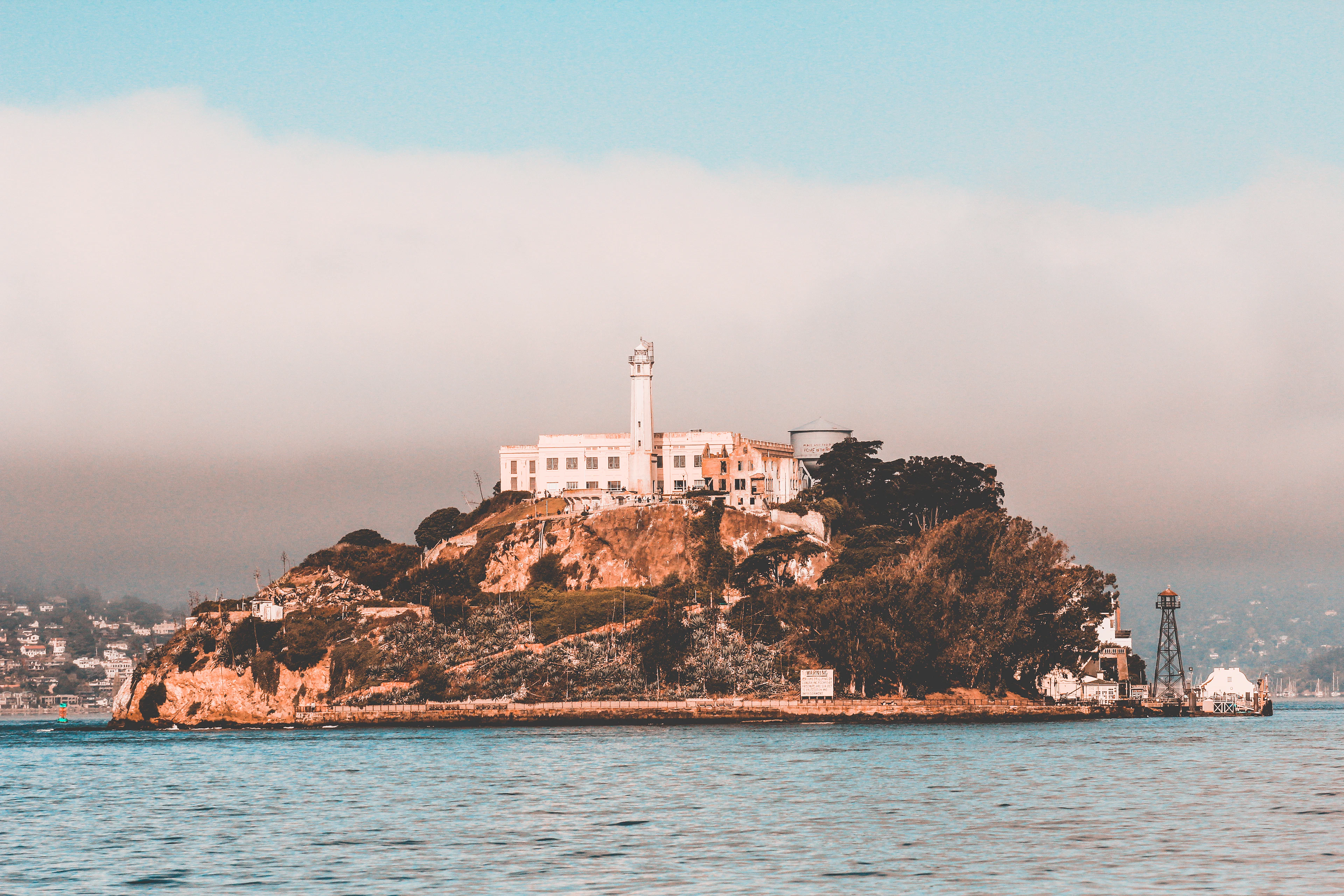 Alcatraz Island and its lighthouse under low fog