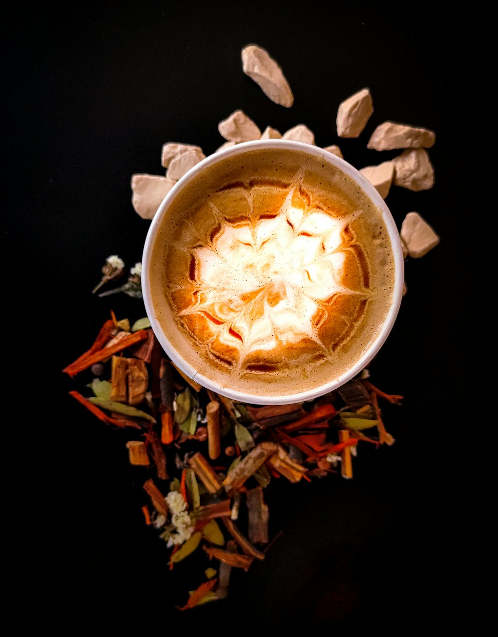 white ceramic bowl with brown leaves