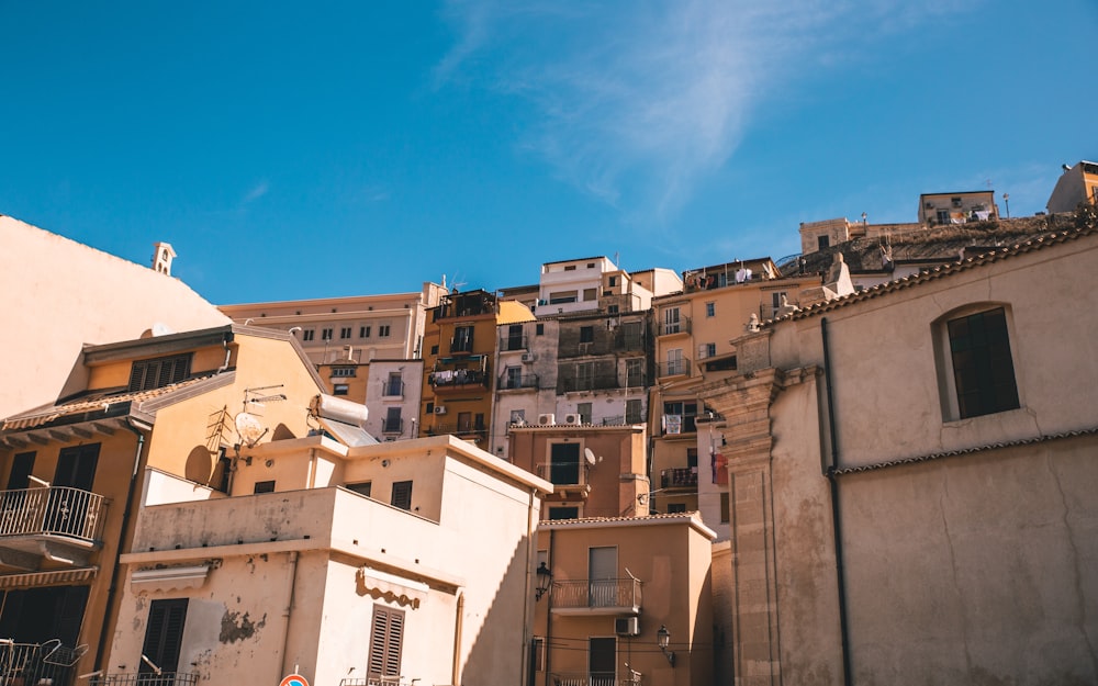 white and brown concrete buildings under blue sky during daytime