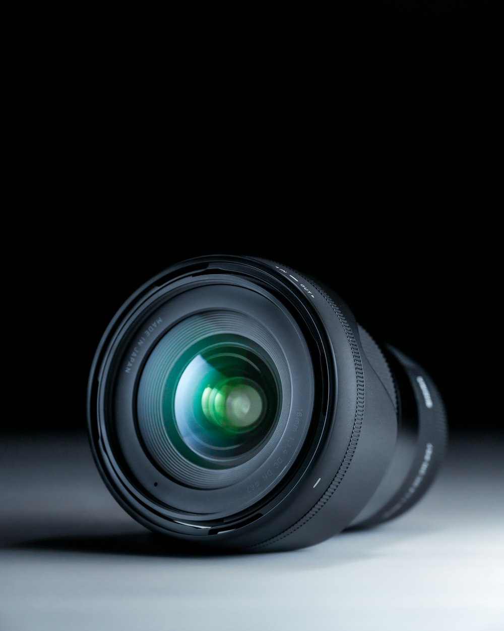 black camera lens on black surface