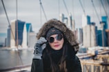 A model wearing a trendy winter hat in a city setting.