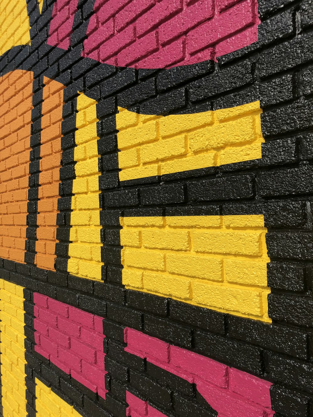 yellow and pink brick wall