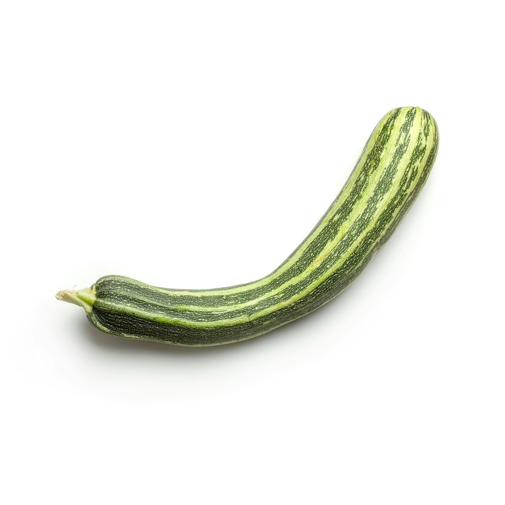 green cucumber on white background