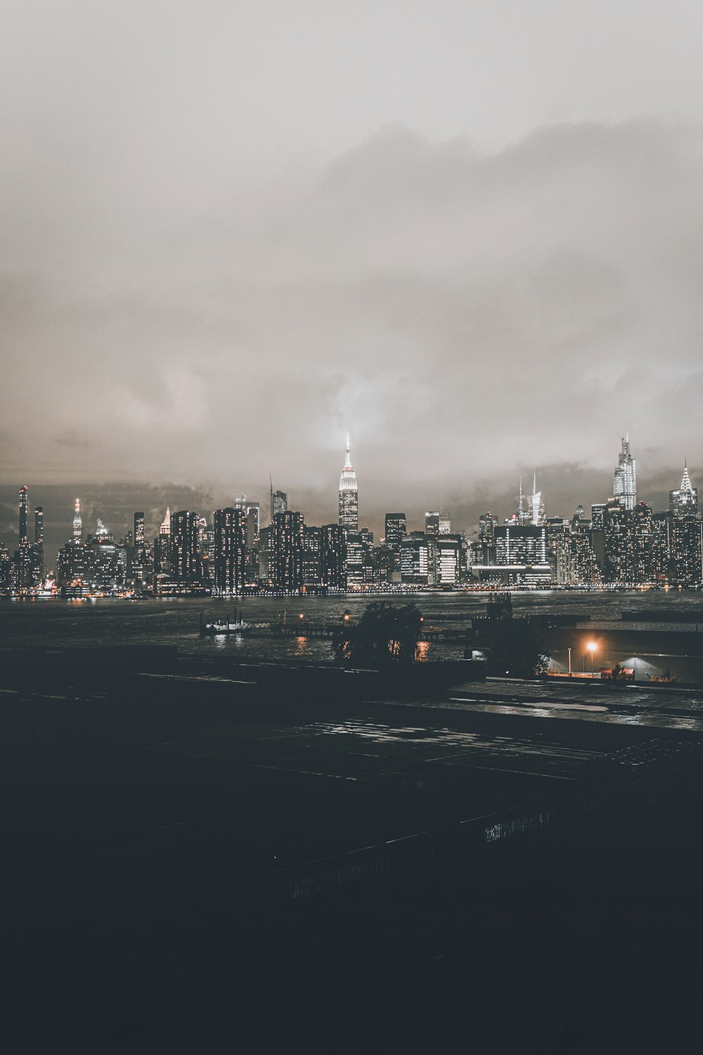 city skyline under gray cloudy sky during daytime