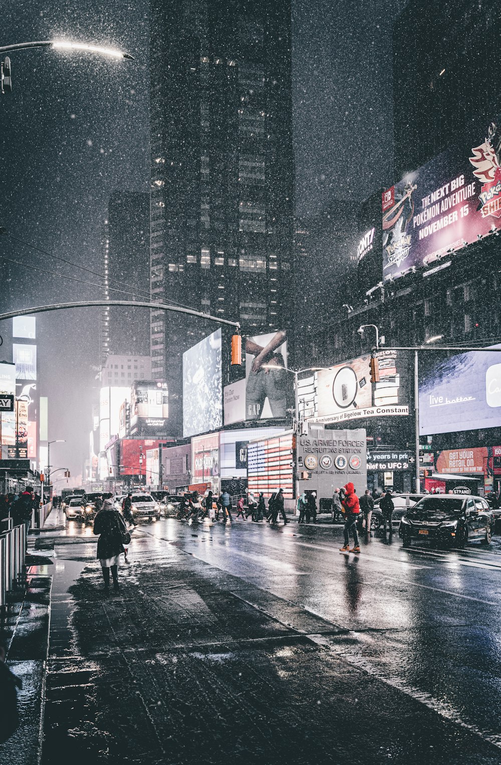 people walking on pedestrian lane during night time