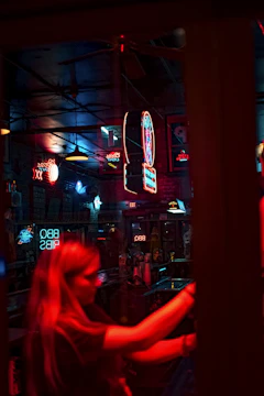 A chaotic bar fight scene drenched in deep reds and blacks, with punk rock flair.