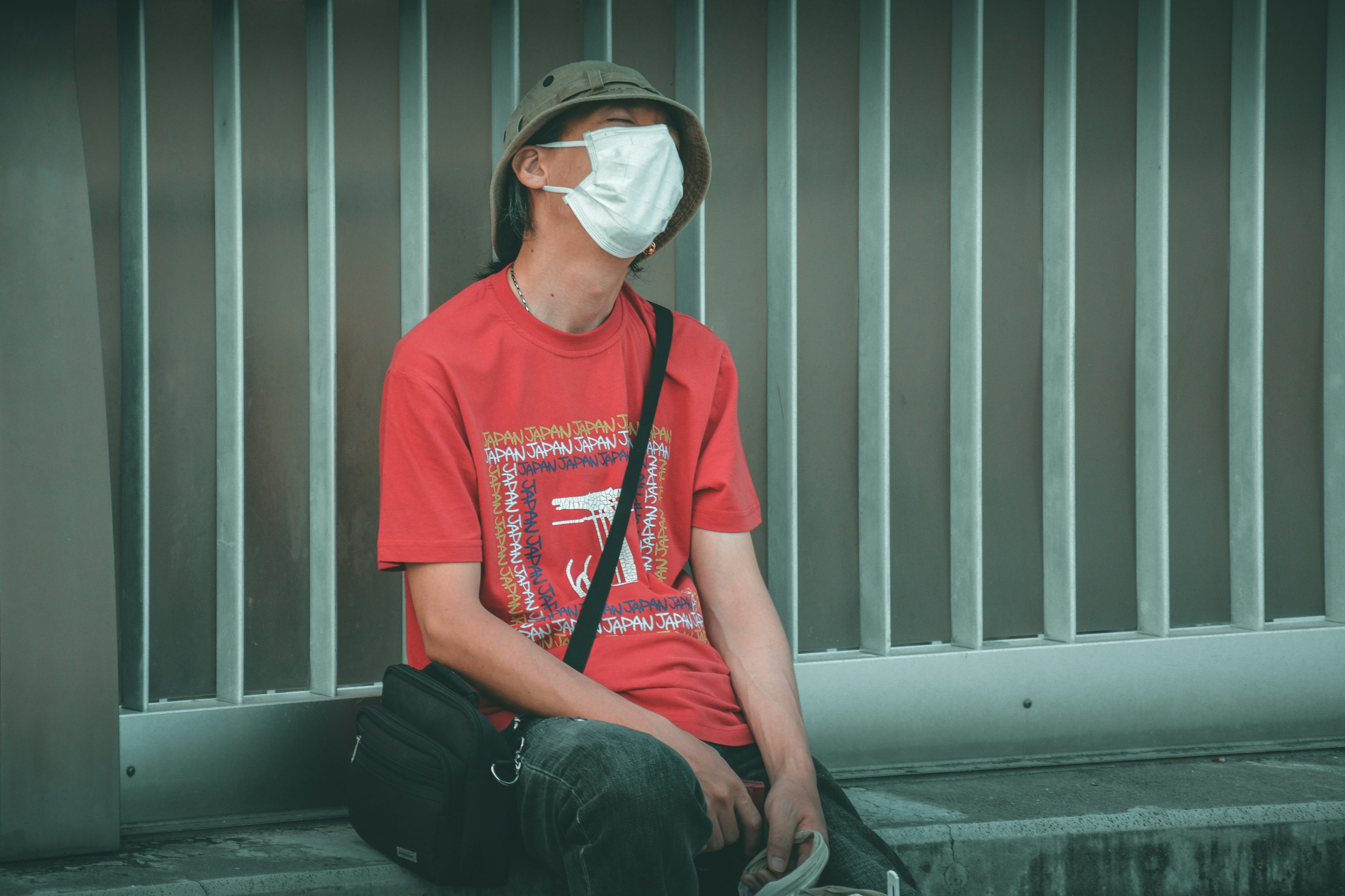 Street person wearing a sanitary mask 