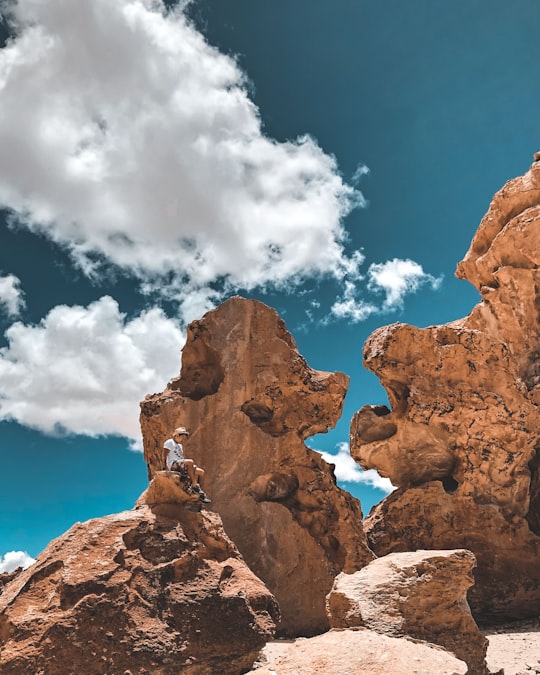 brown rock formation under blue sky and white clouds during daytime in Potosi Bolivia
