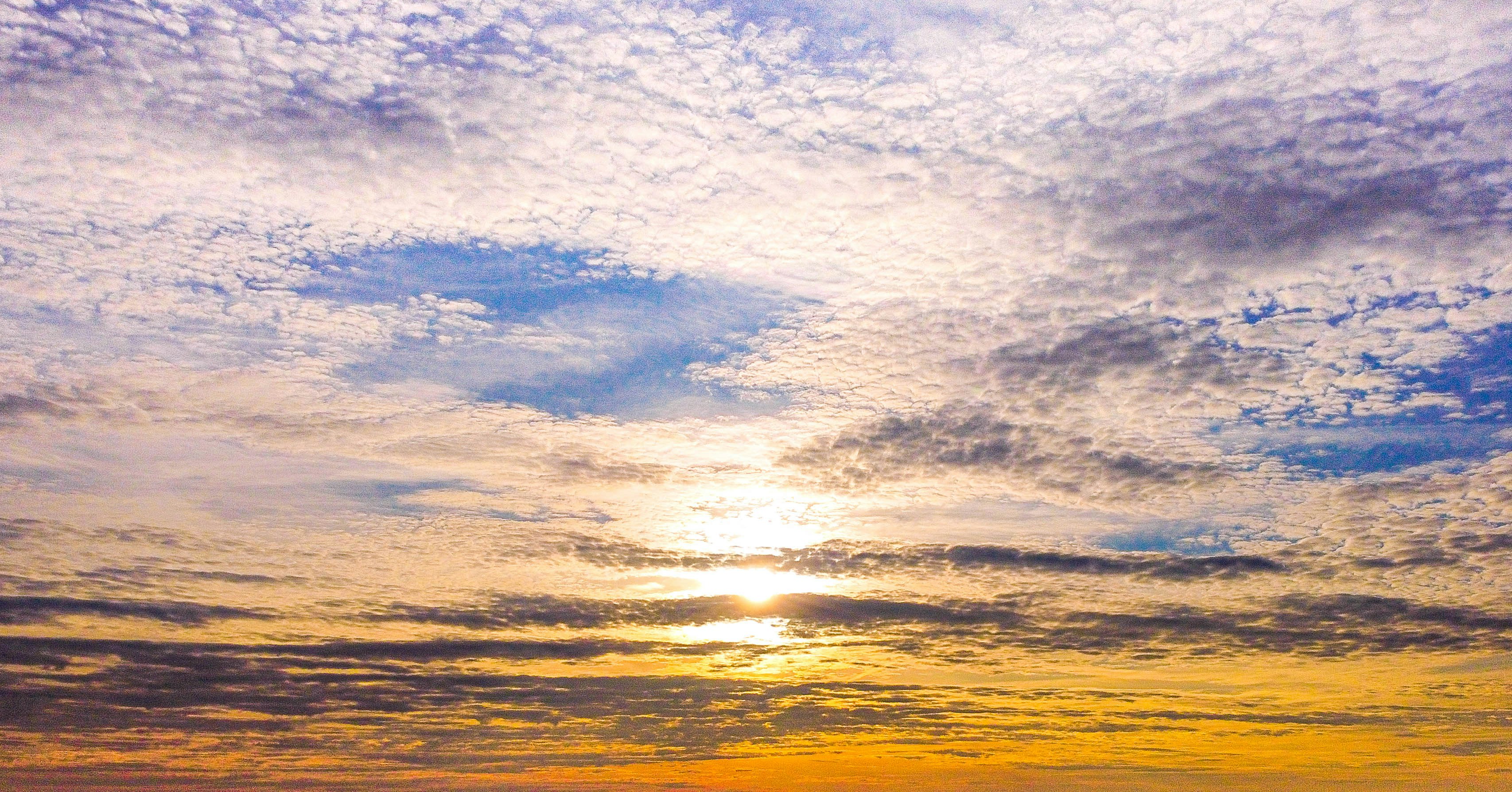 white clouds and blue sky during sunset