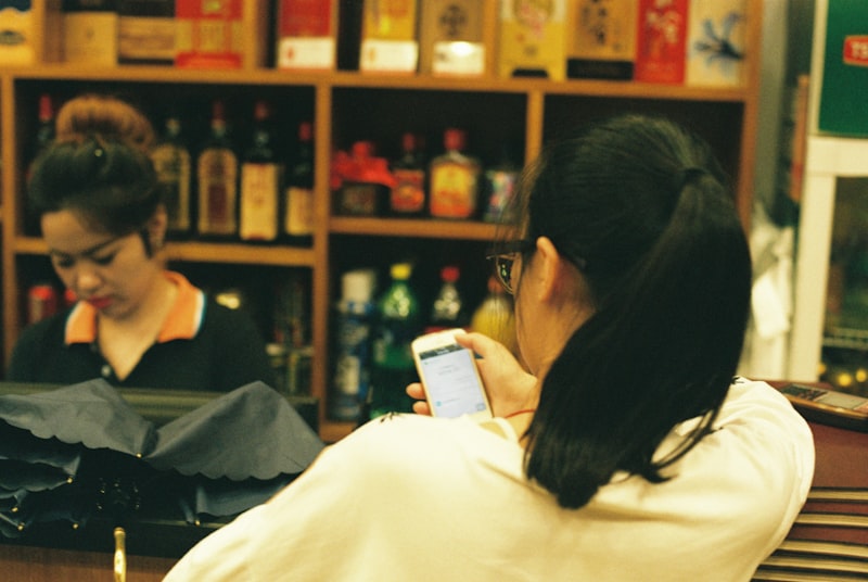 salon owner using smartphone for customer messages