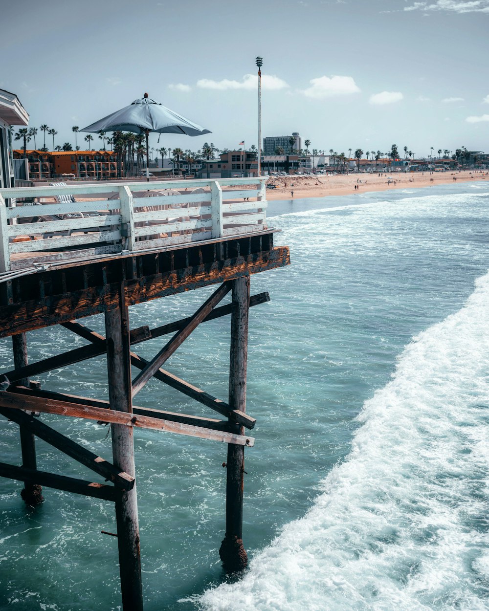 brown wooden dock on sea during daytime