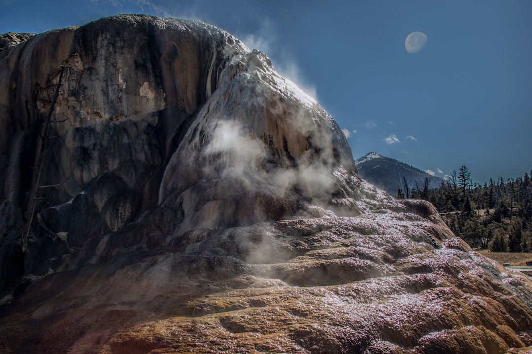 gray rocky mountain under blue sky during daytime