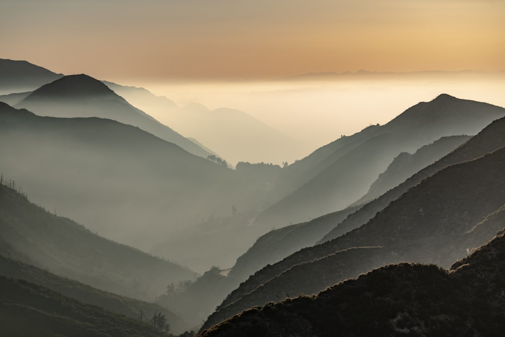 mountains under white sky during daytime