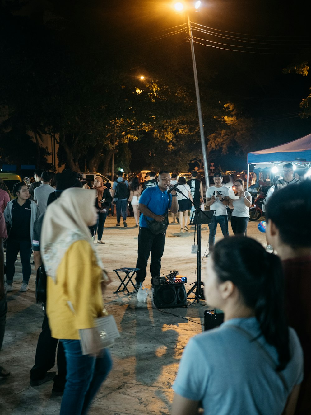 people standing on street during night time