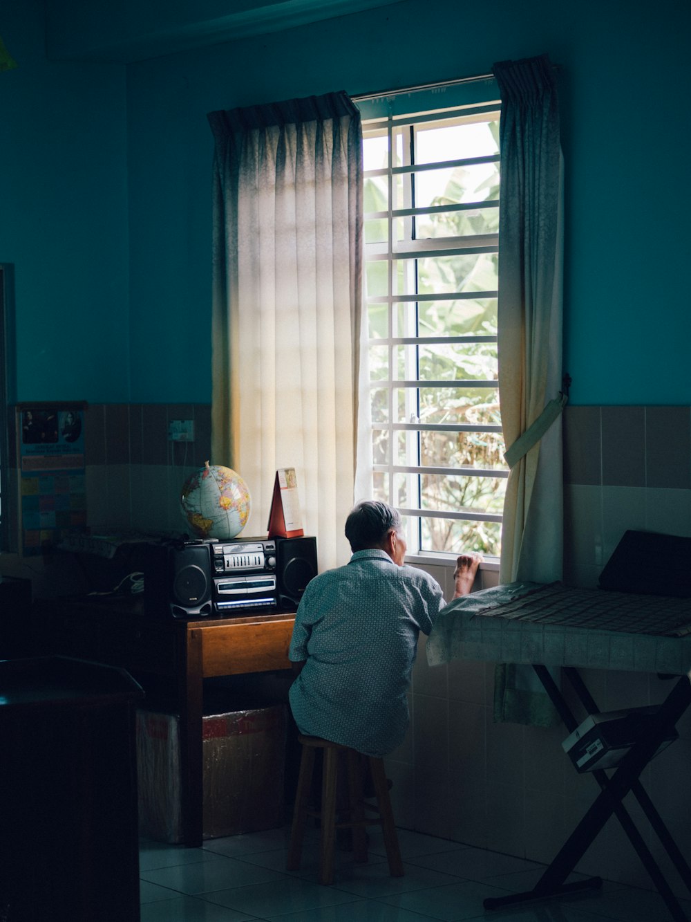 woman in white robe sitting on chair