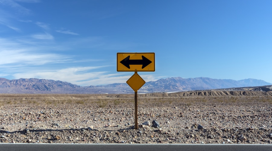 a road sign pointing in opposite directions in the desert