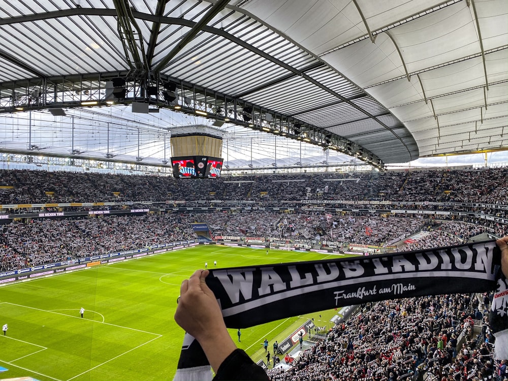 people watching soccer game on stadium