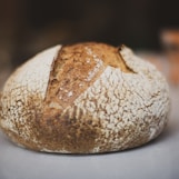 brown and white bread on white table