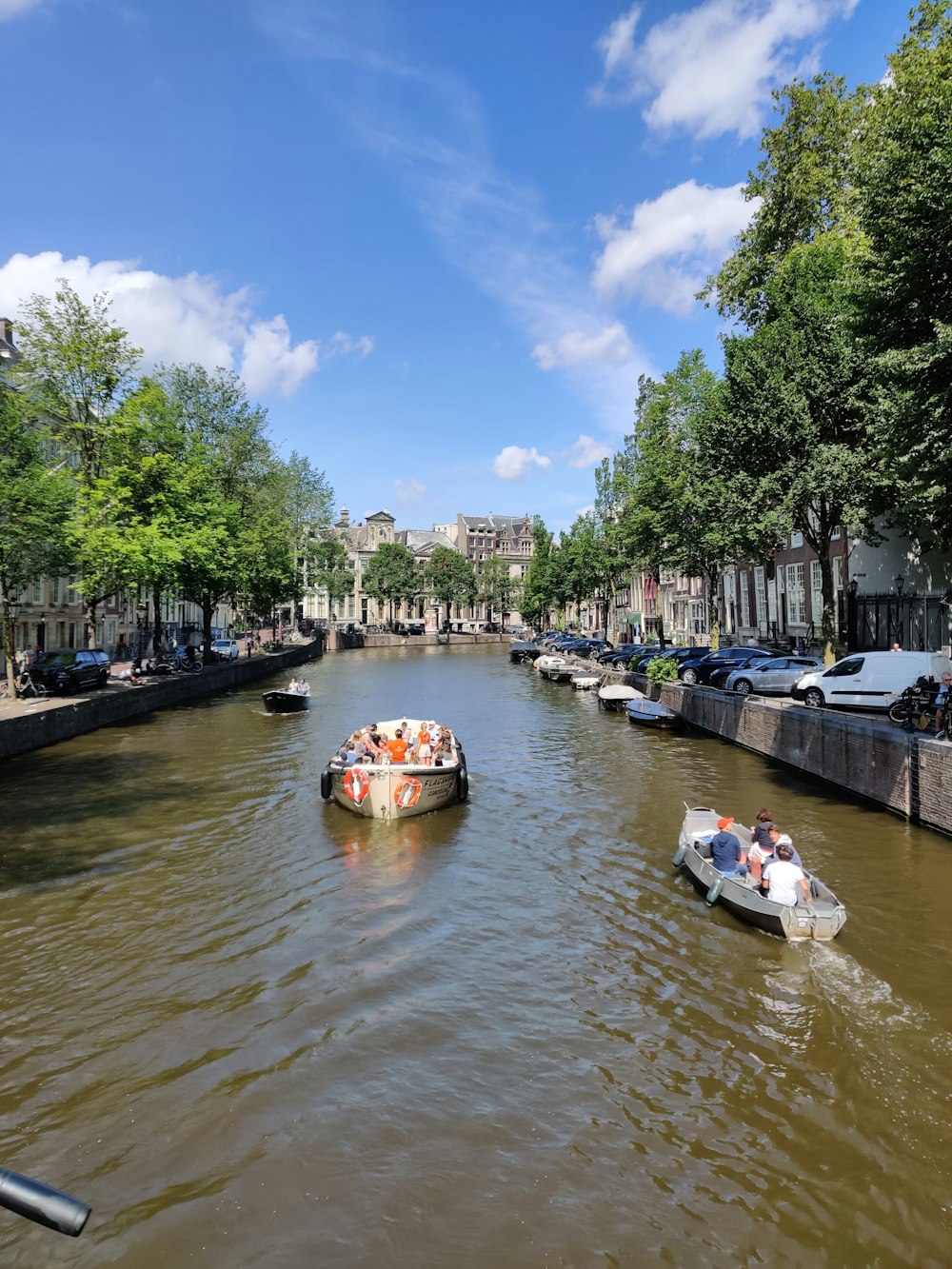 people riding on boat on river during daytime