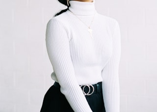 woman in white turtleneck sweater
