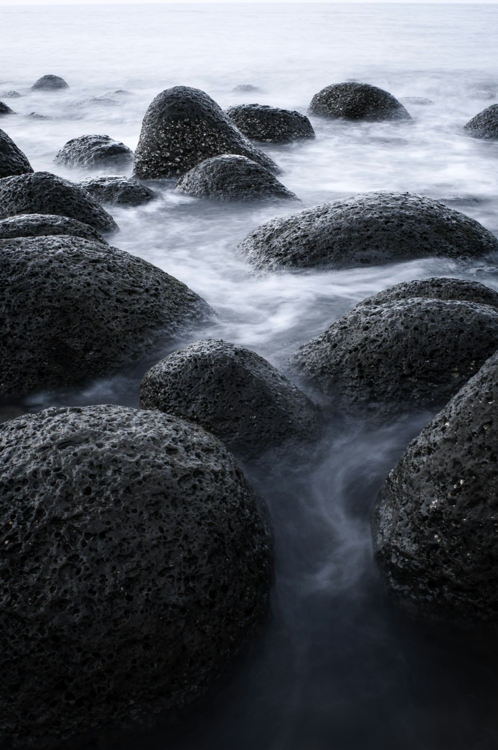 Nikon AF Nikkor 28mm F2.8D sample photo. Black rock formation on photography