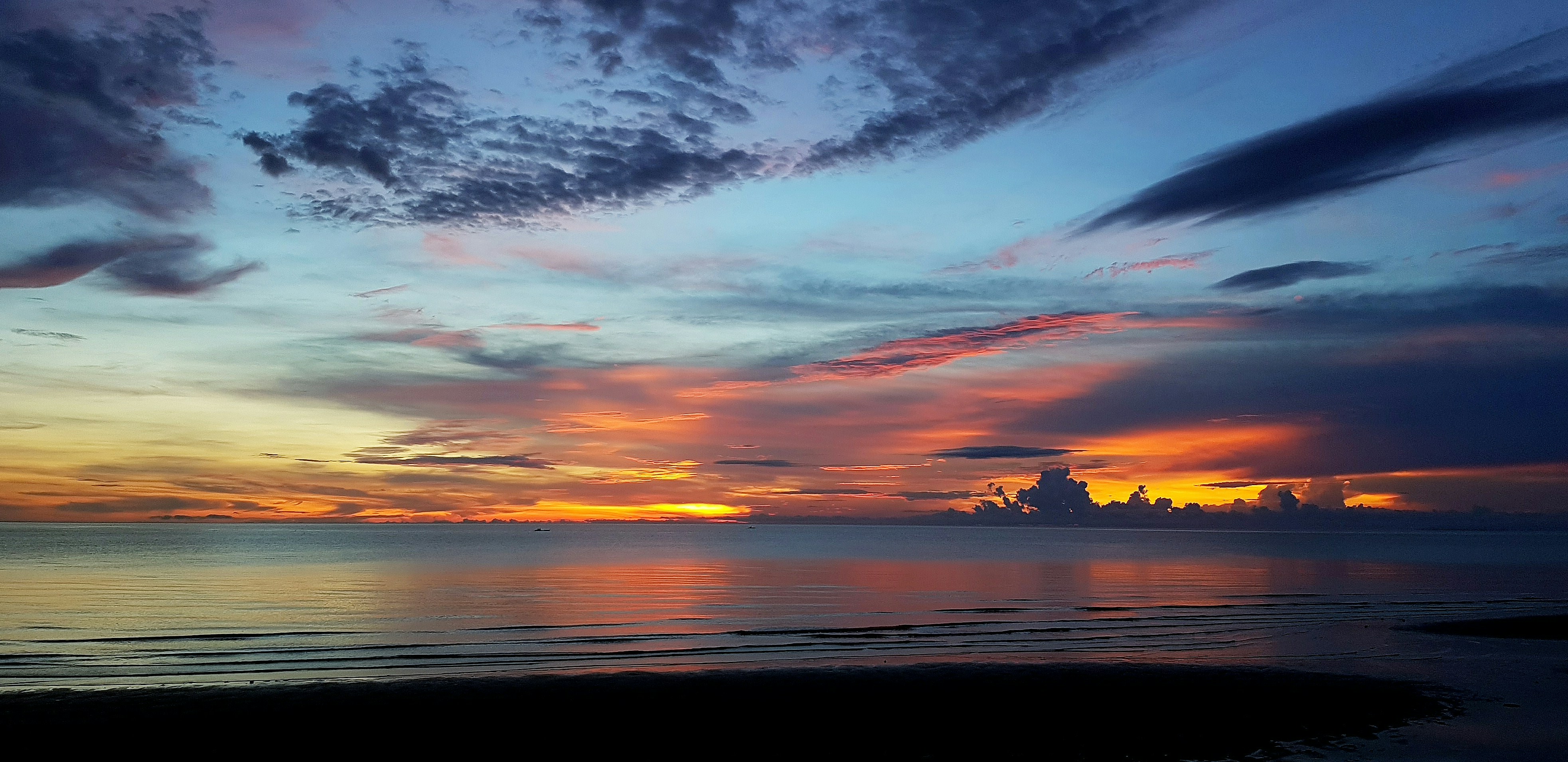 body of water during sunset