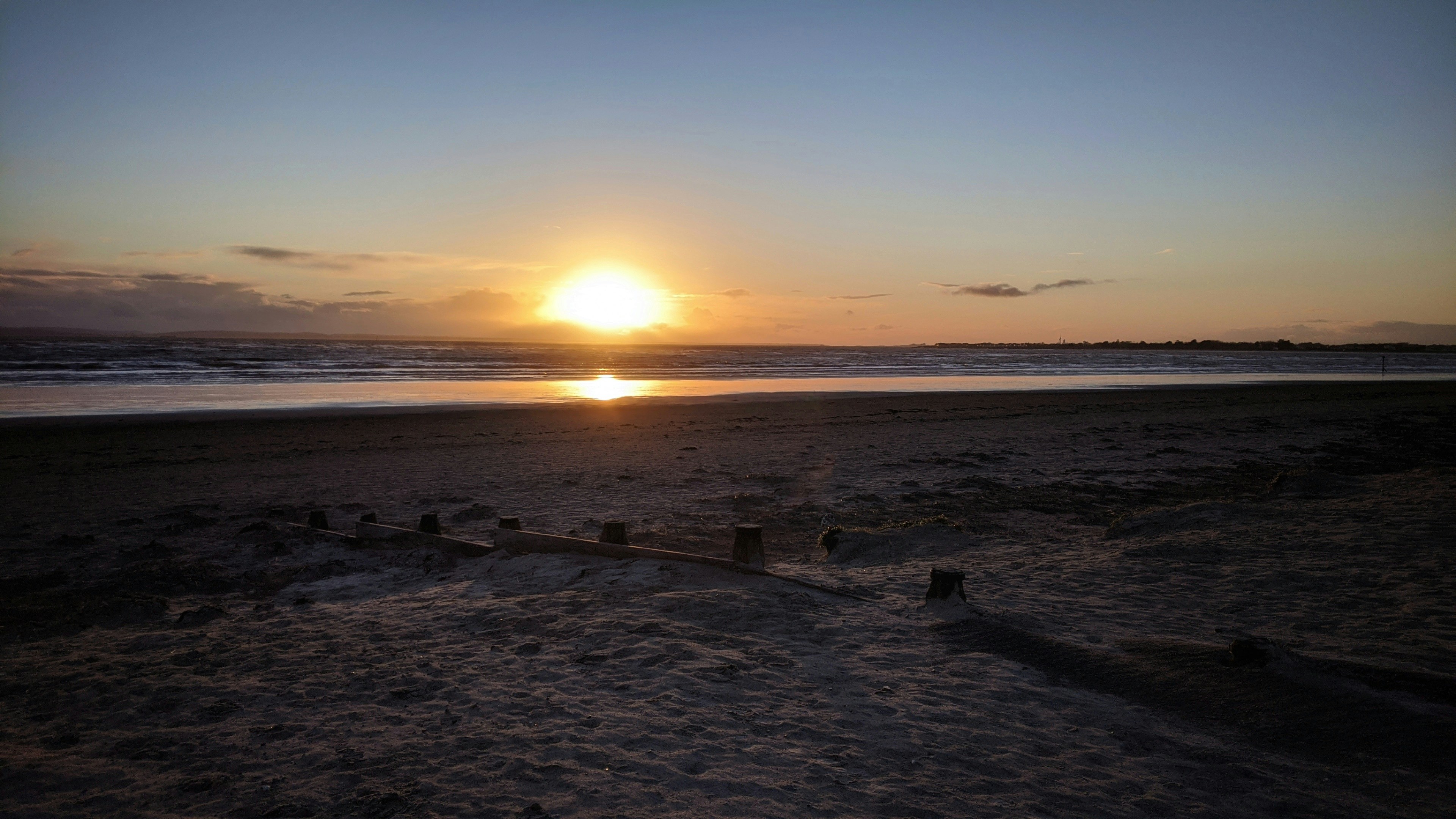 silhouette of people on beach during sunset