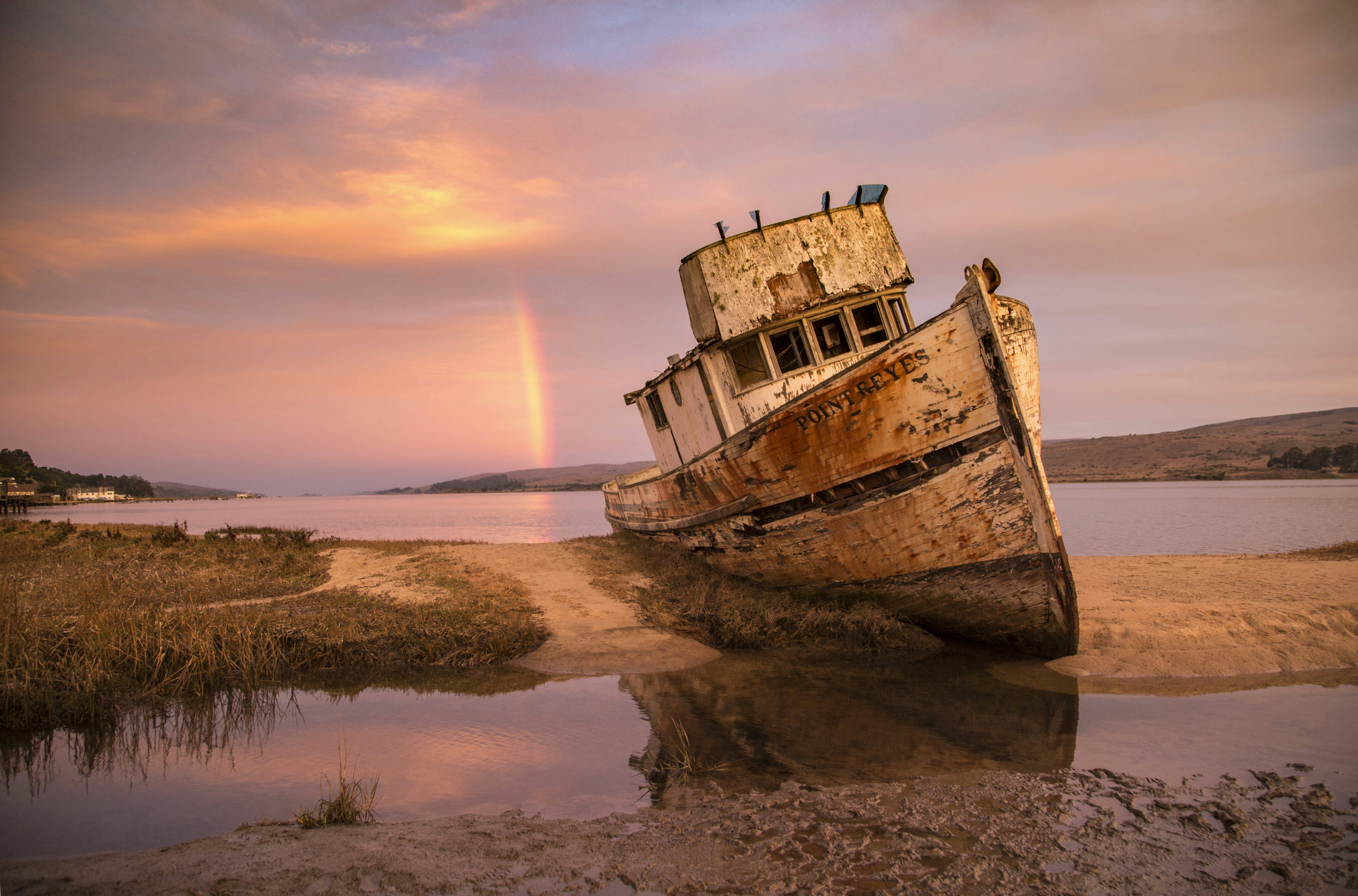 brown ship on sea shore during sunset, 