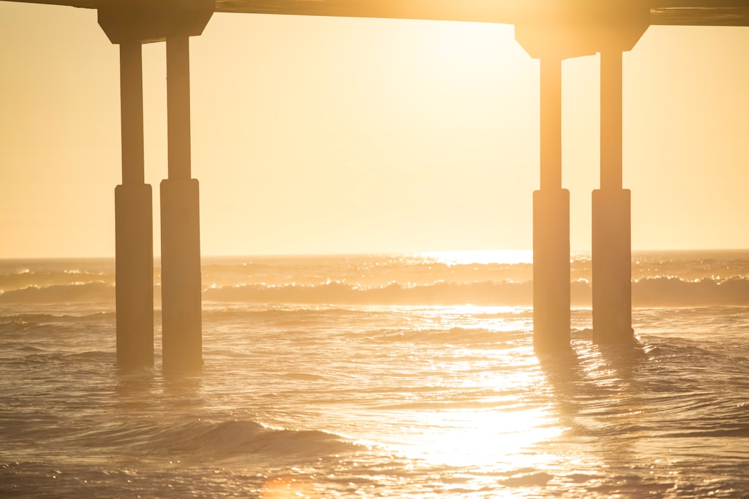 body of water during sunset