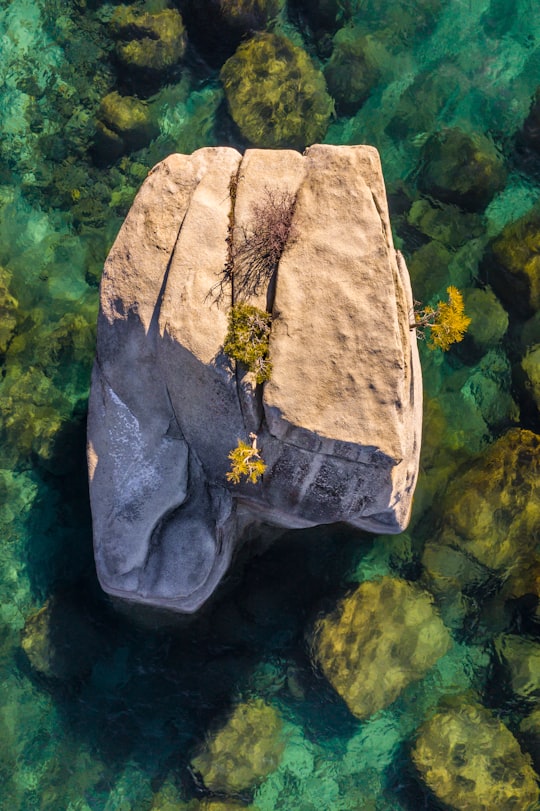 brown rock on body of water in Lake Tahoe United States