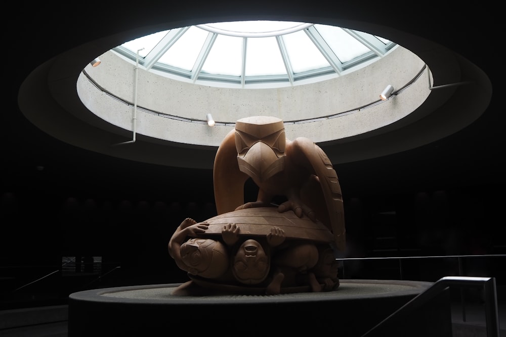 brown wooden animal figurine on white round ceiling