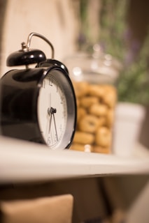 black and silver alarm clock