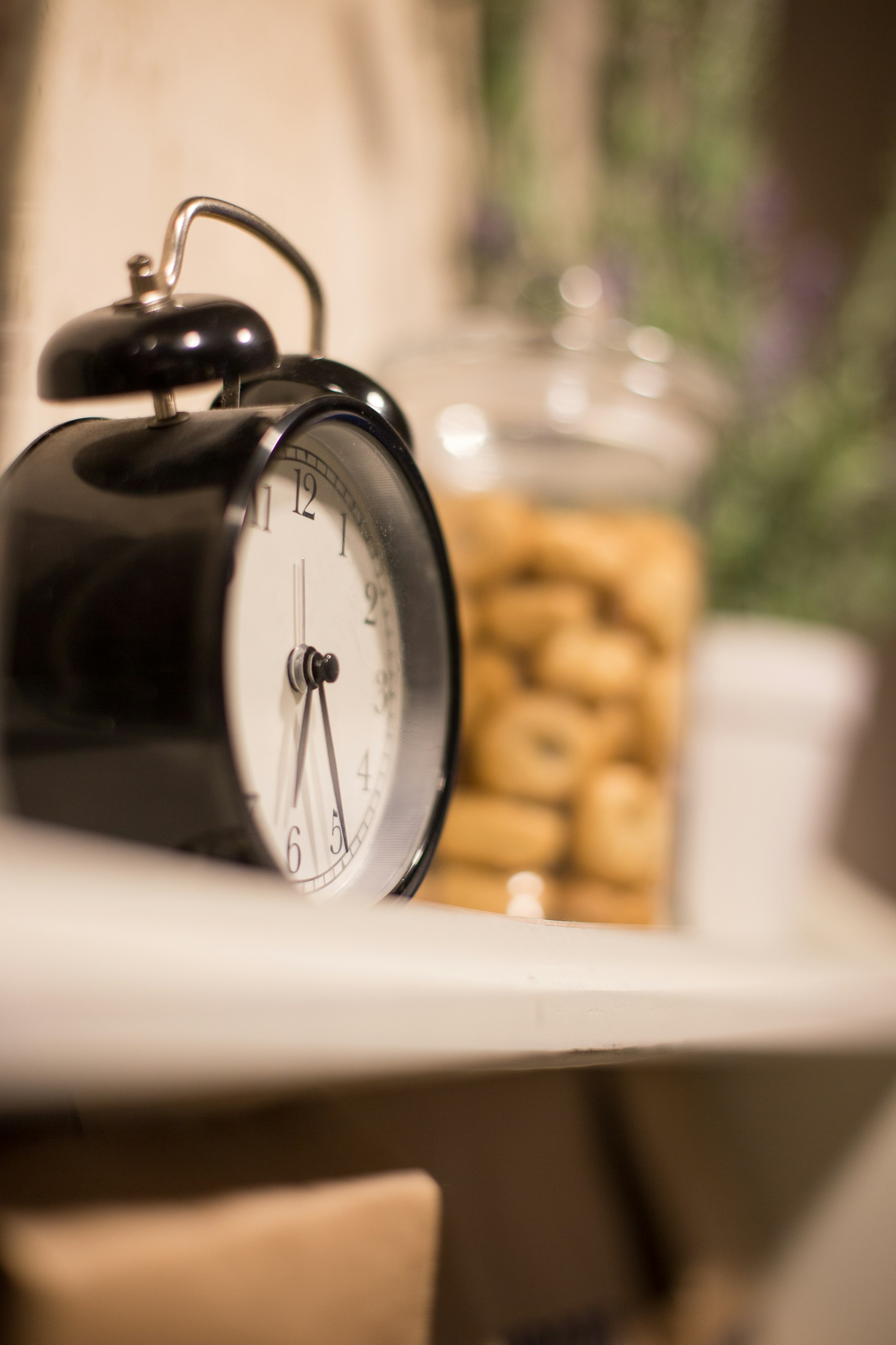A clock on a shelf. Time for coffee. 