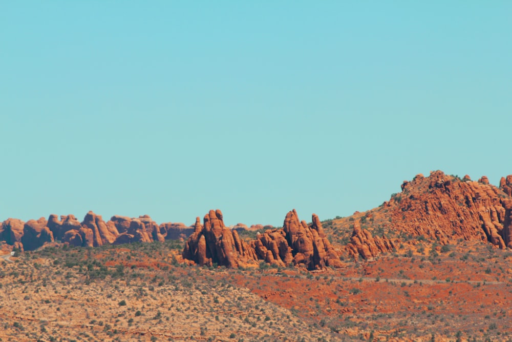 brown rocky mountain under blue sky during daytime