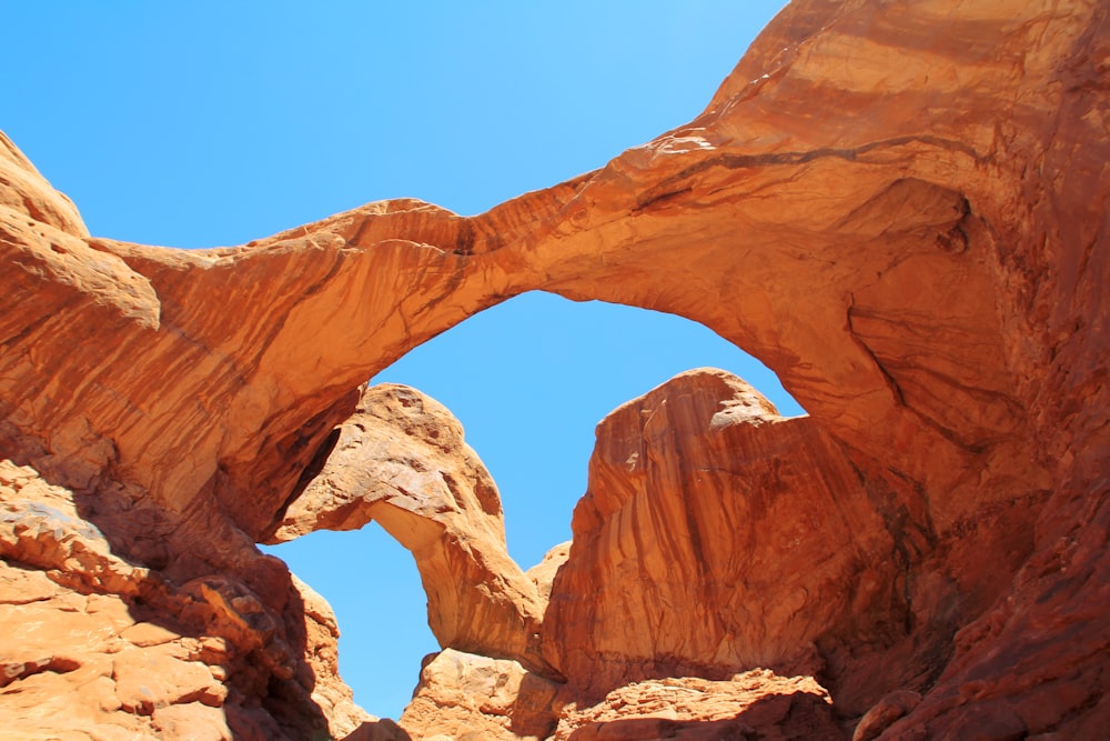 brown rock formation under blue sky during daytime