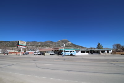 white and blue airplane on gray asphalt road during daytime nevada google meet background